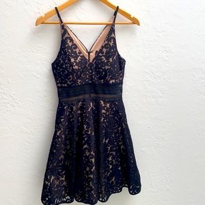 Cocktail dress with sheer mid-drift.